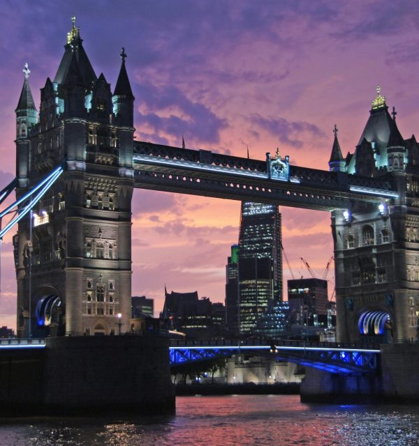 Iconic Tower Bridge in London against a stunning sunset sky. Perfect for travel and architecture themes.