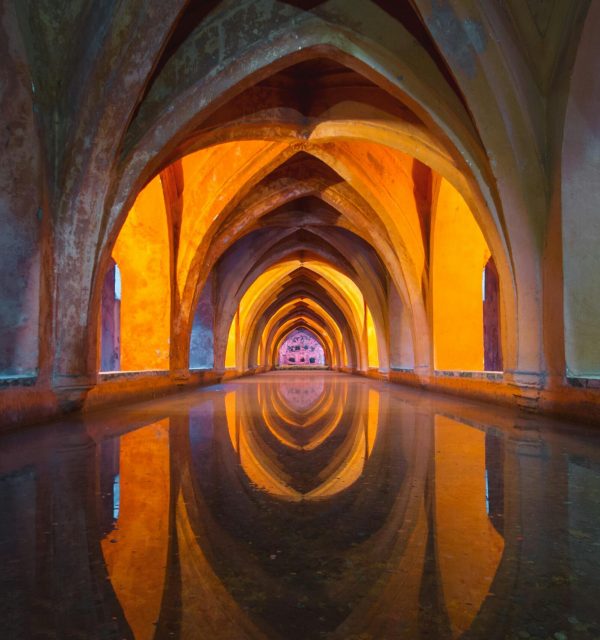 Beautiful Gothic arches reflecting in water, vibrant colors create a mesmerizing effect.